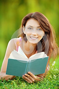 Girl-student read a textbook.