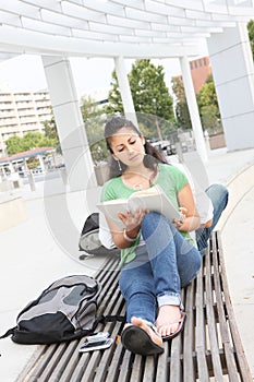Girl Student Reading on the School Campus