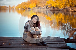 Girl student rests on the pier