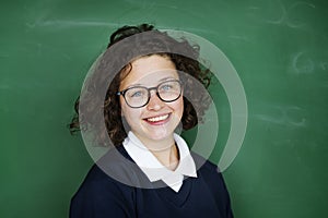 Girl student smiling and blackboard