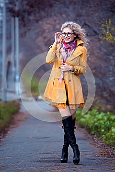 Girl student walks in the park.