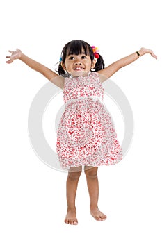 Girl in studio with arms outstretched