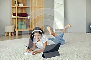 Girl studying online using modern tech at home