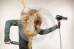 Girl styling her long hair