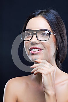 Girl with stylish glasses and teeth braces photo