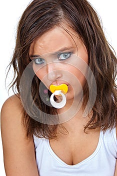 Girl sucking a pacifier