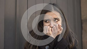 Girl suddenly feeling uncontrolled attack of fear in street, mental disorders photo