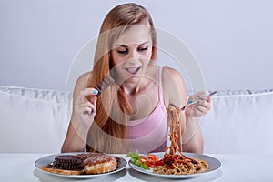 Girl suffering from bulimia eats dinner photo