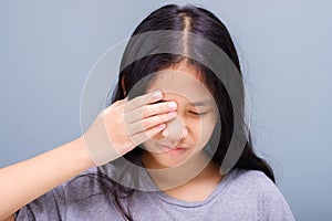 Girl suffering from eye irritation