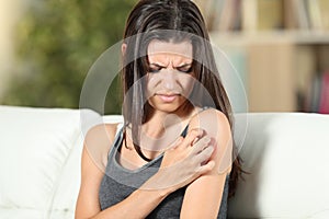 Girl suffering skin irritation scratching arm