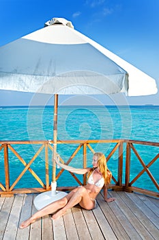 The girl sunbathes on a tropical beach