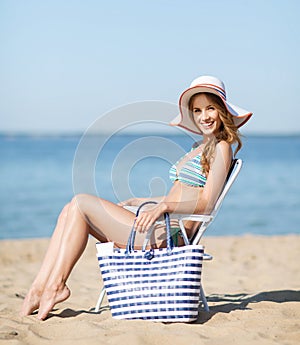 Girl sunbathing on the beach chair