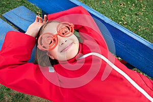 Girl with sunglasses and red jacket