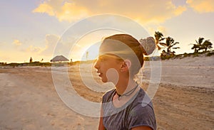 Girl at sunset caribbean beach in Mexico