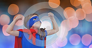 Girl in super hero costume over blur background