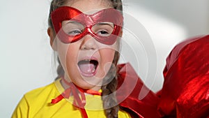 girl superhero portrait face. feminism a happy family a close-up home kid dream concept. child superhero in mask