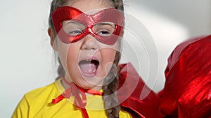 girl superhero portrait face. feminism a happy family a close-up home kid dream concept. child superhero in mask