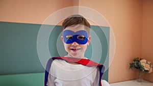 girl superhero portrait face. feminism a happy family a close-up home kid dream concept. child superhero in mask