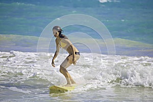 Girl surfing at Kailua Beach