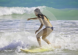 Girl surfing at Kailua Beach