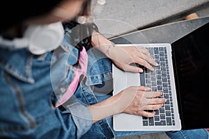 Girl surfs the net on her laptop.