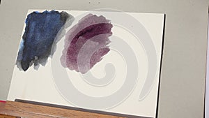 Girl swatching purple with oxyde black watercolor