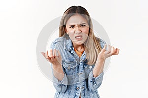 Girl swearing cursing cruel unfair life losing chance participate event. Upset intense annoyed hateful asian blond girl