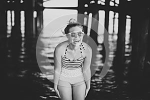 Girl in Swim suit under pier