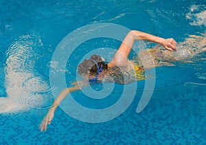 Girl swim in the swimming pool