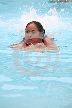 Girl swiming in pool