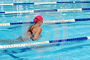 Girl swimming breaststroke photo