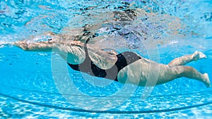 Girl Swimming Close Up Underwater Side On