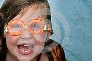 Girl swimming with goggles