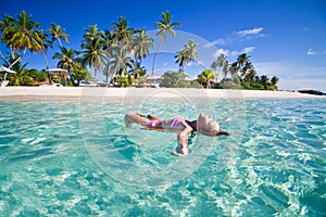 Girl swimming in lagoon