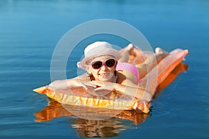 Girl on the swimming mattress