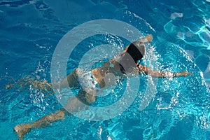 Girl swimming in pool