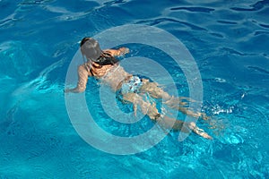 Girl swimming in pool