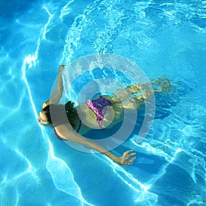 Girl Swimming in a pool