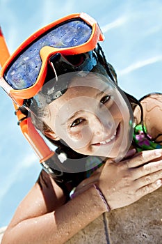 Girl In A Swimming Pool with Goggles and Snorkel