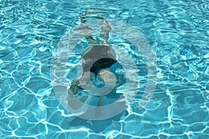 Girl swimming under water