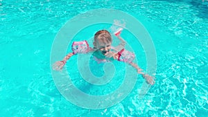 Girl Swims In The Pool