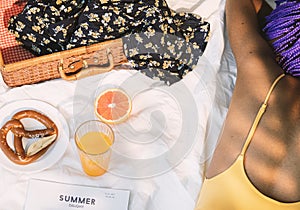 Girl in swimsuit having a picnic