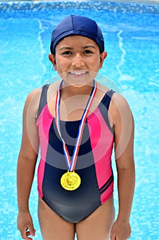 Girl in swimsuit with medals