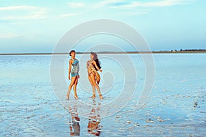 a girl in a swimsuit on a salt lake