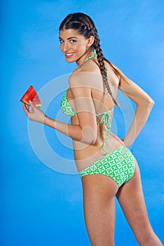 Girl in swimsuit with watermelon