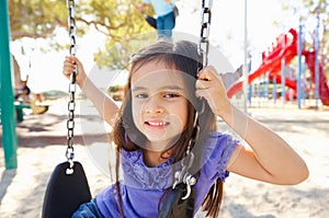 Girl On Swing In Park