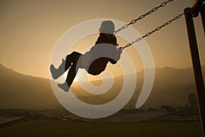 Girl on Swing at sunset