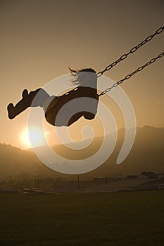 Girl on Swing at sunset