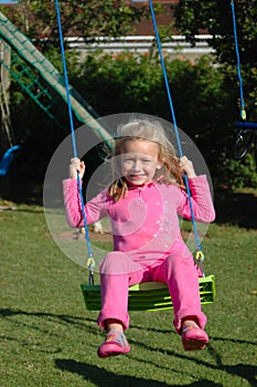 Girl swinging photo