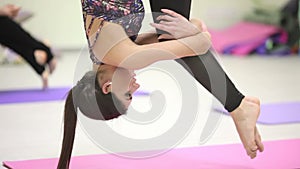 Girl swinging in aerobic yoga elastic band. Flay fitness